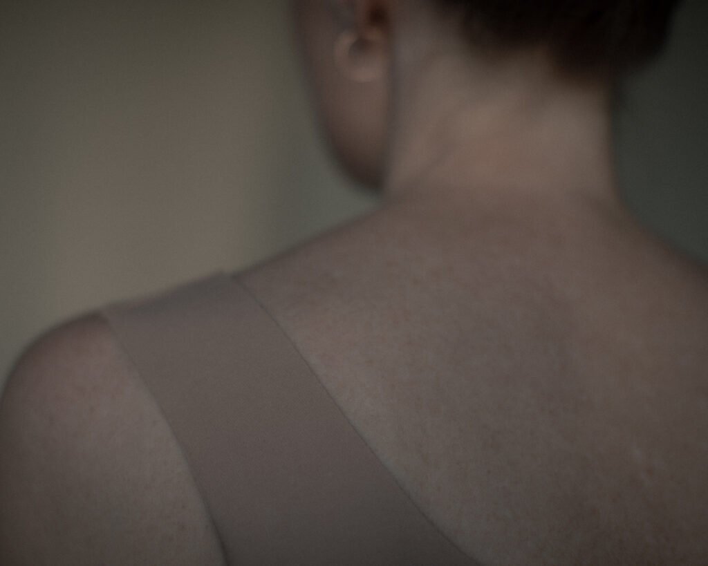 Minimal portrait exploring softness, skin texture, and quiet human presence.