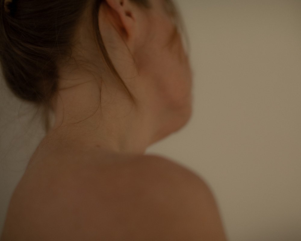Minimal portrait exploring stillness, softness, and quiet human atmosphere.